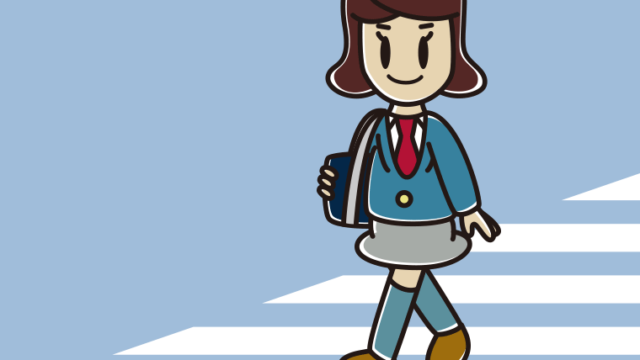 横断歩道を渡る女子高校生