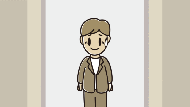 エレベーターで苦笑いする男性会社員（カジュアル）