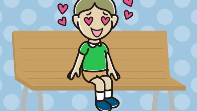 ベンチで目がハートの小学生男子のイラスト【色、背景あり】PNG