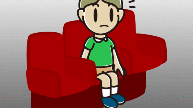 映画館（劇場）で何かに気付く小学生男子のイラスト【色、背景あり】PNG